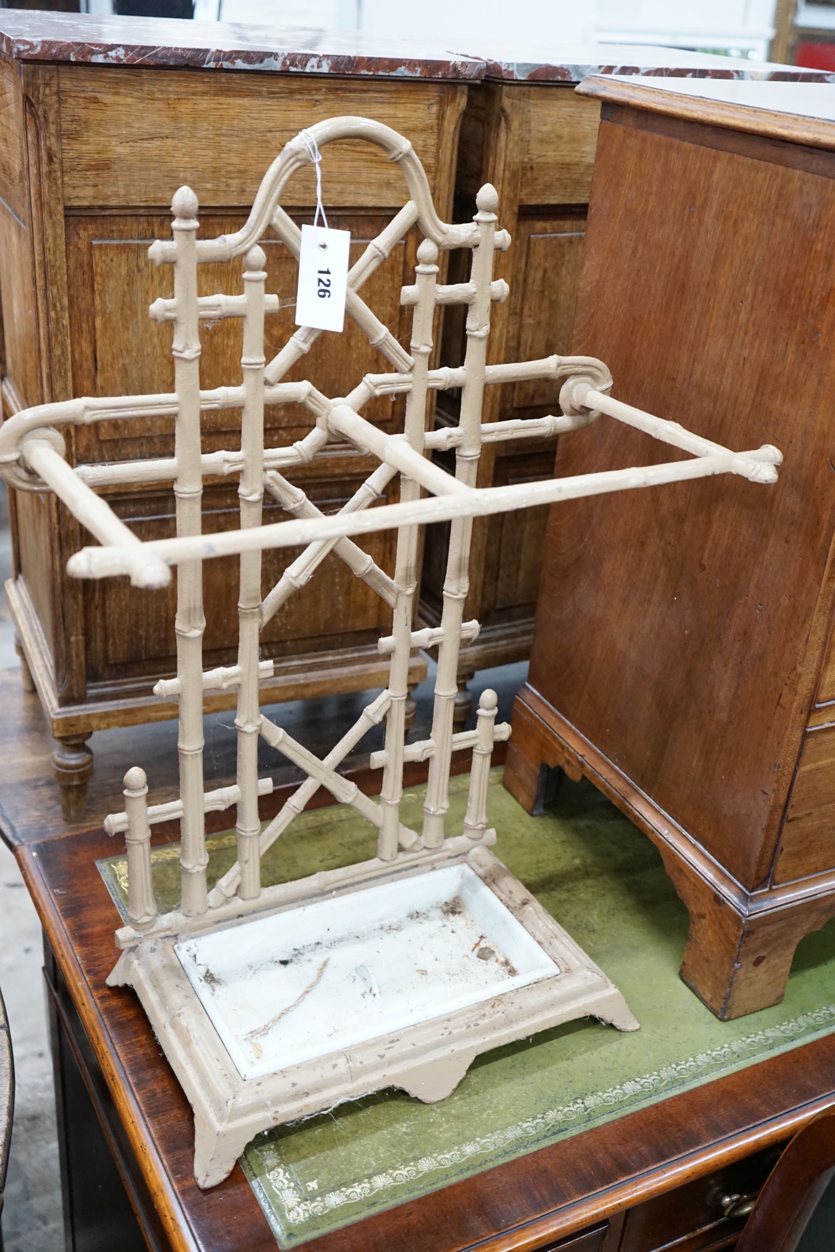 A Victorian style painted metal faux bamboo stick stand, width 52cm, height 70cm